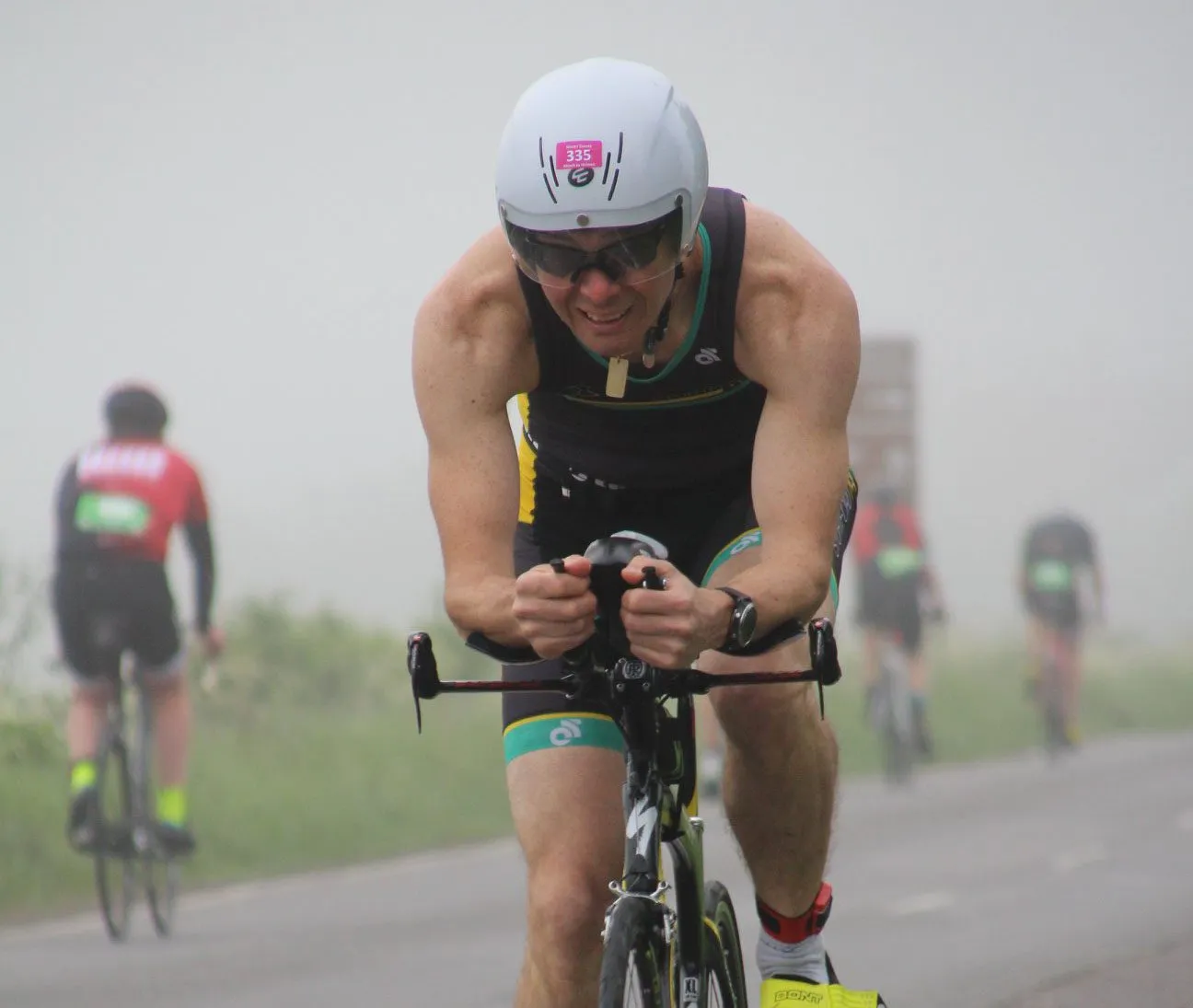 A Stortford Tri member on the bike leg of a triathlon, in club trisuit